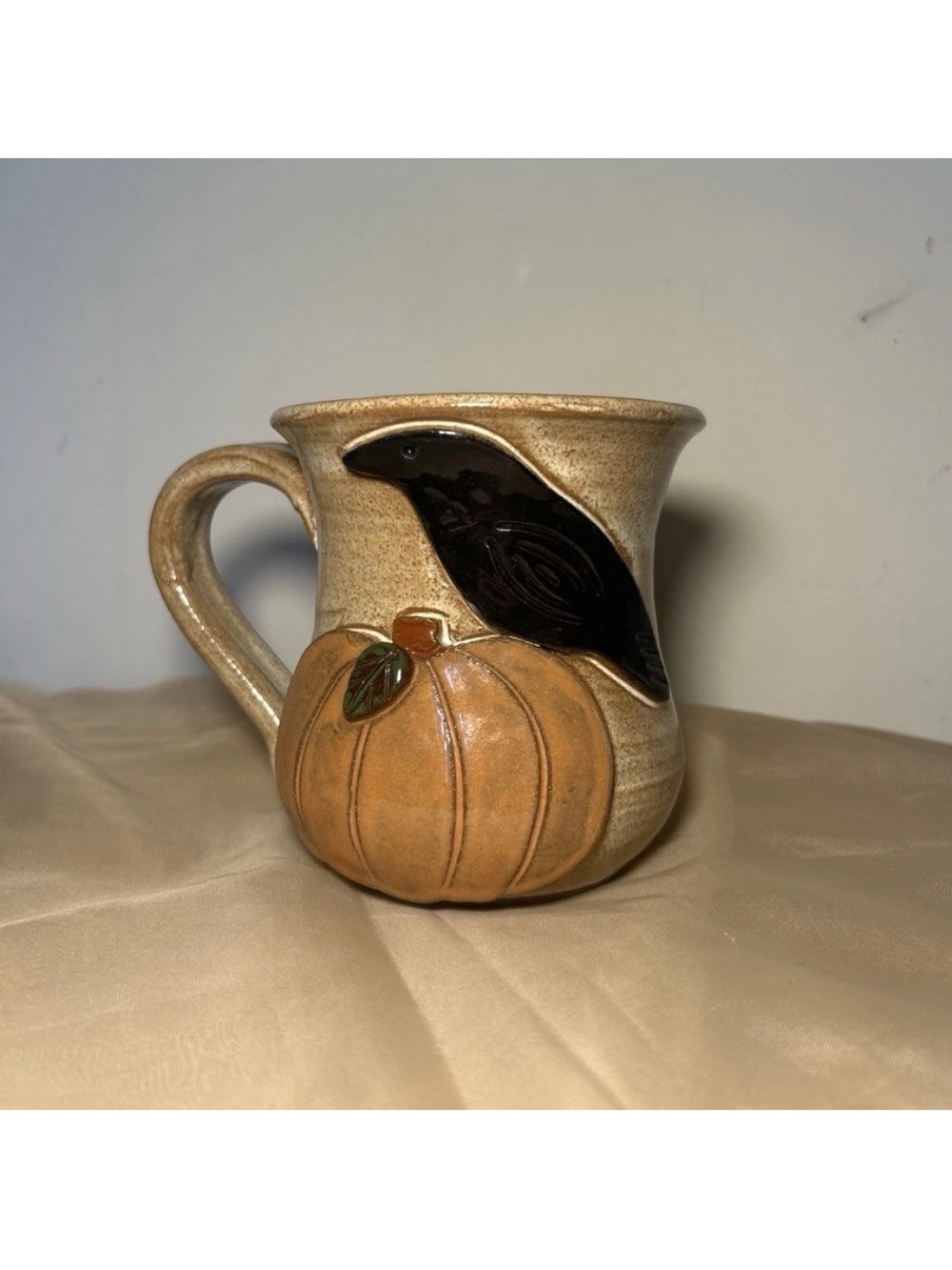 Handmade pottery MudWorks crow and pumpkin mug